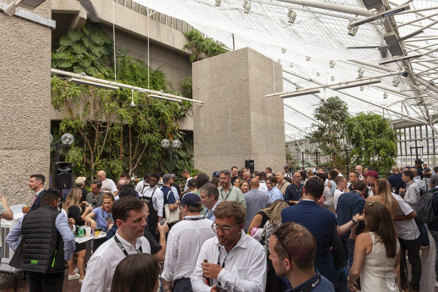 Delegates networking in the Barbican conservatory at Cannabis Europa London 2025